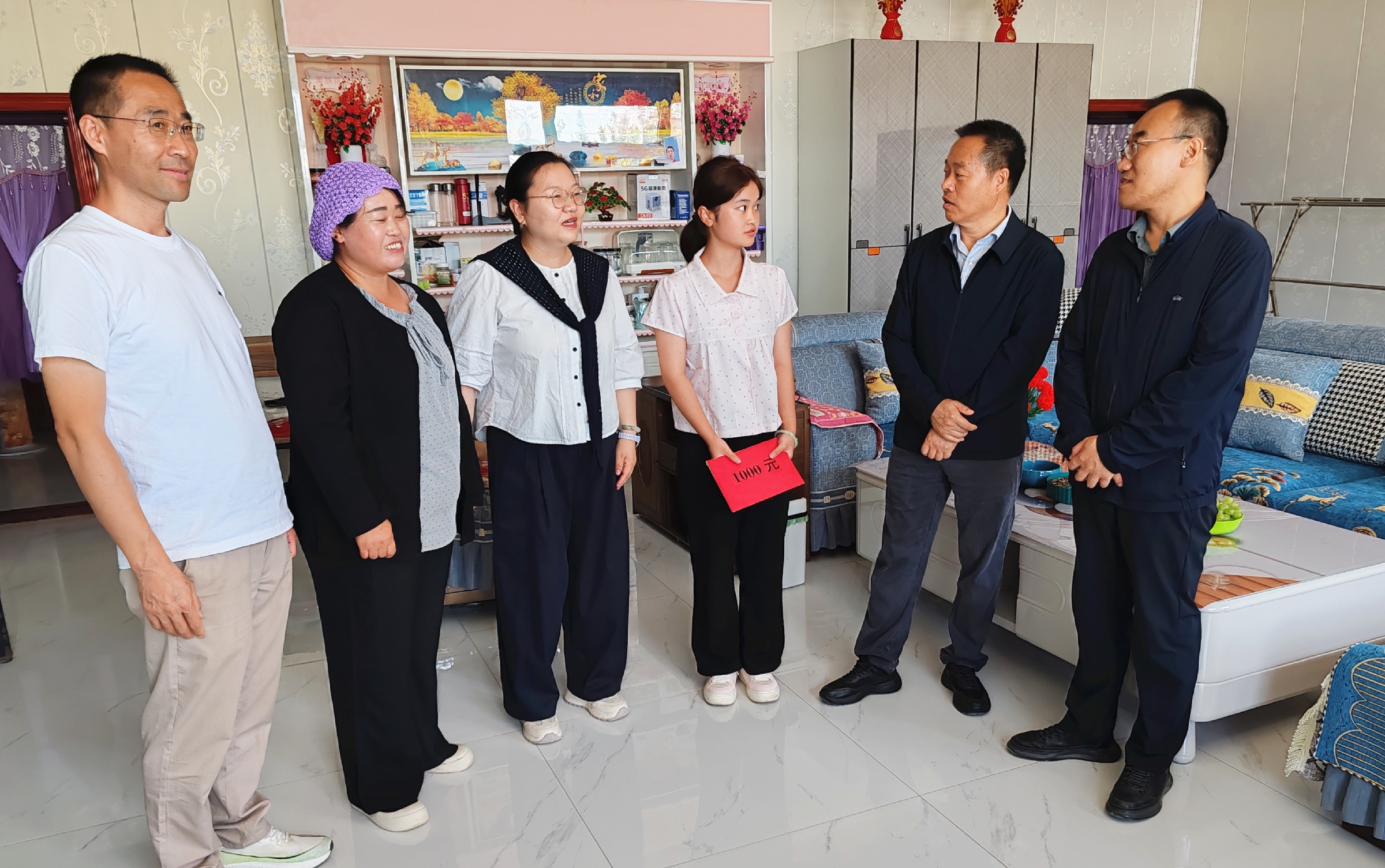 民进固原市委会开展金秋助学活动.jpg